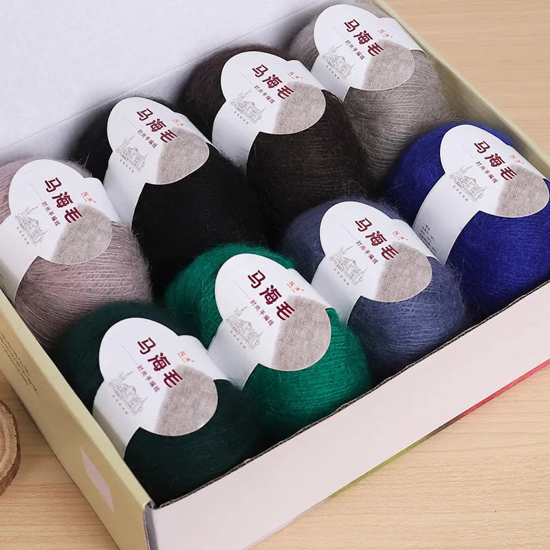 Ball of mohair yarn with Inverness thread for DIY scarf knitting kit in various colours.