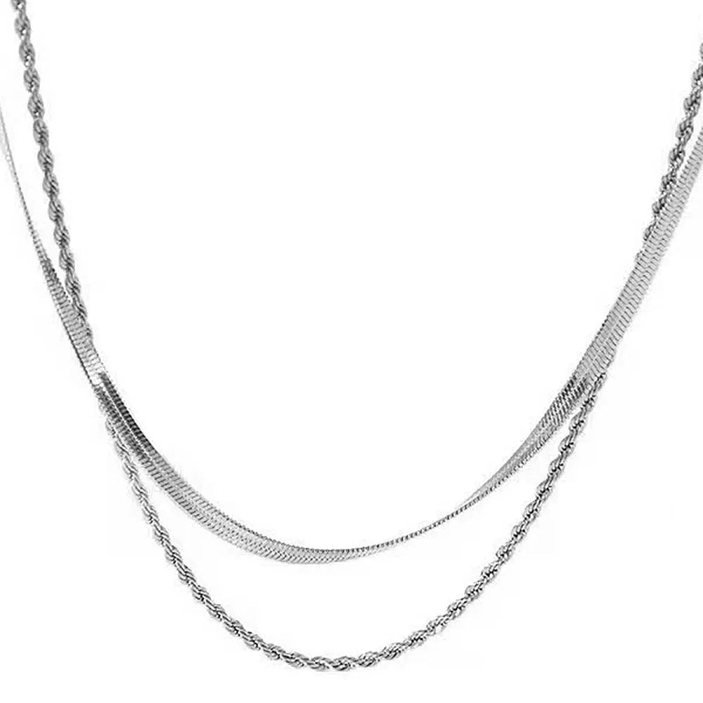 Retro double-layer twist necklace with geometric titanium steel pendant on an adjustable snake bones chain.