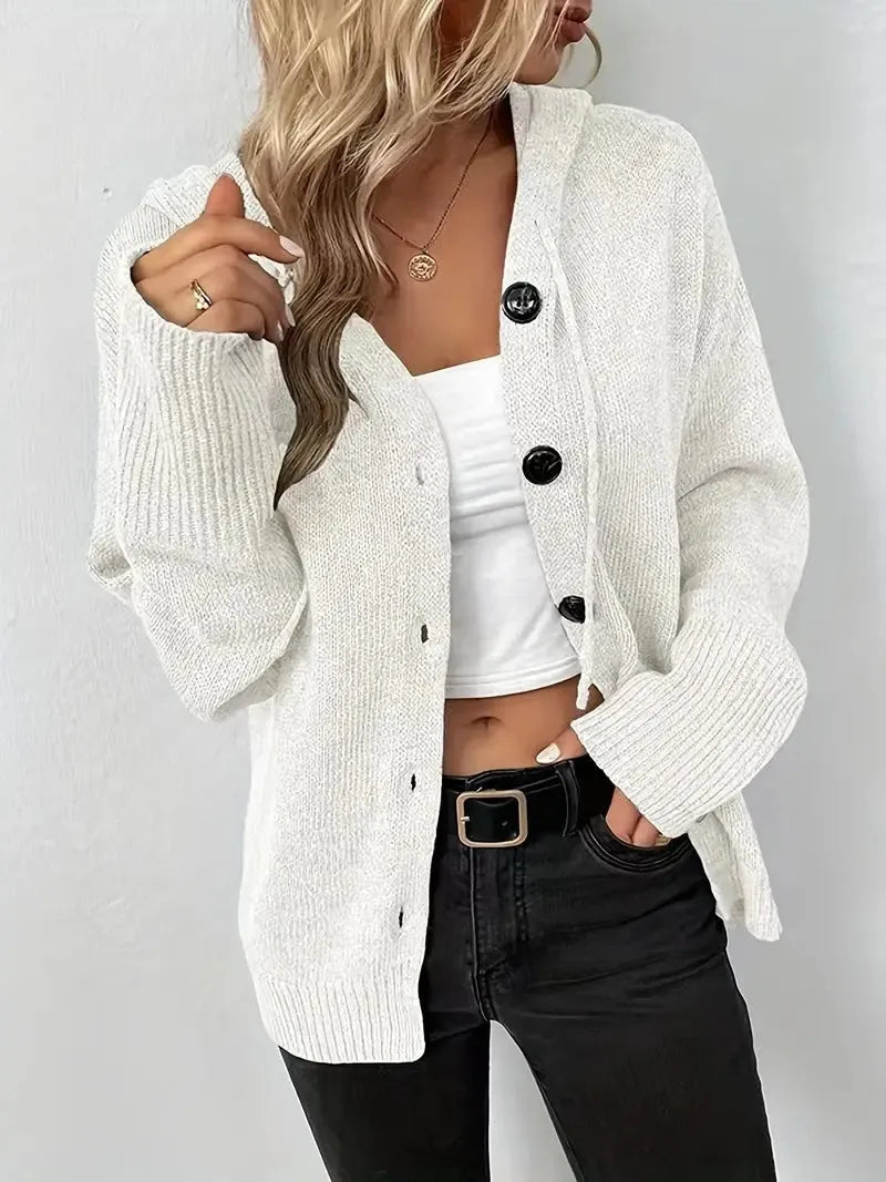 A solid colour hooded cotton cardigan sweater shown in a loose fit on a model.