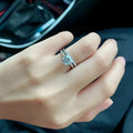 Adjustable heart-shaped moissanite couple ring with dragon, phoenix, and ten thousand words decorations on a silver-plated band.