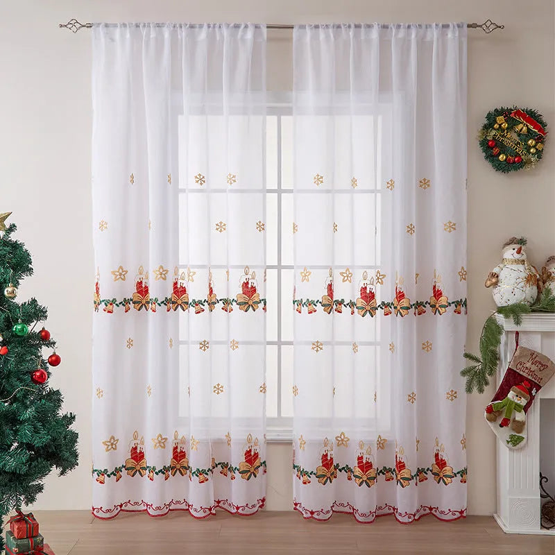Pair of white polyester Christmas curtains with embroidered red snowflake design hung on a window