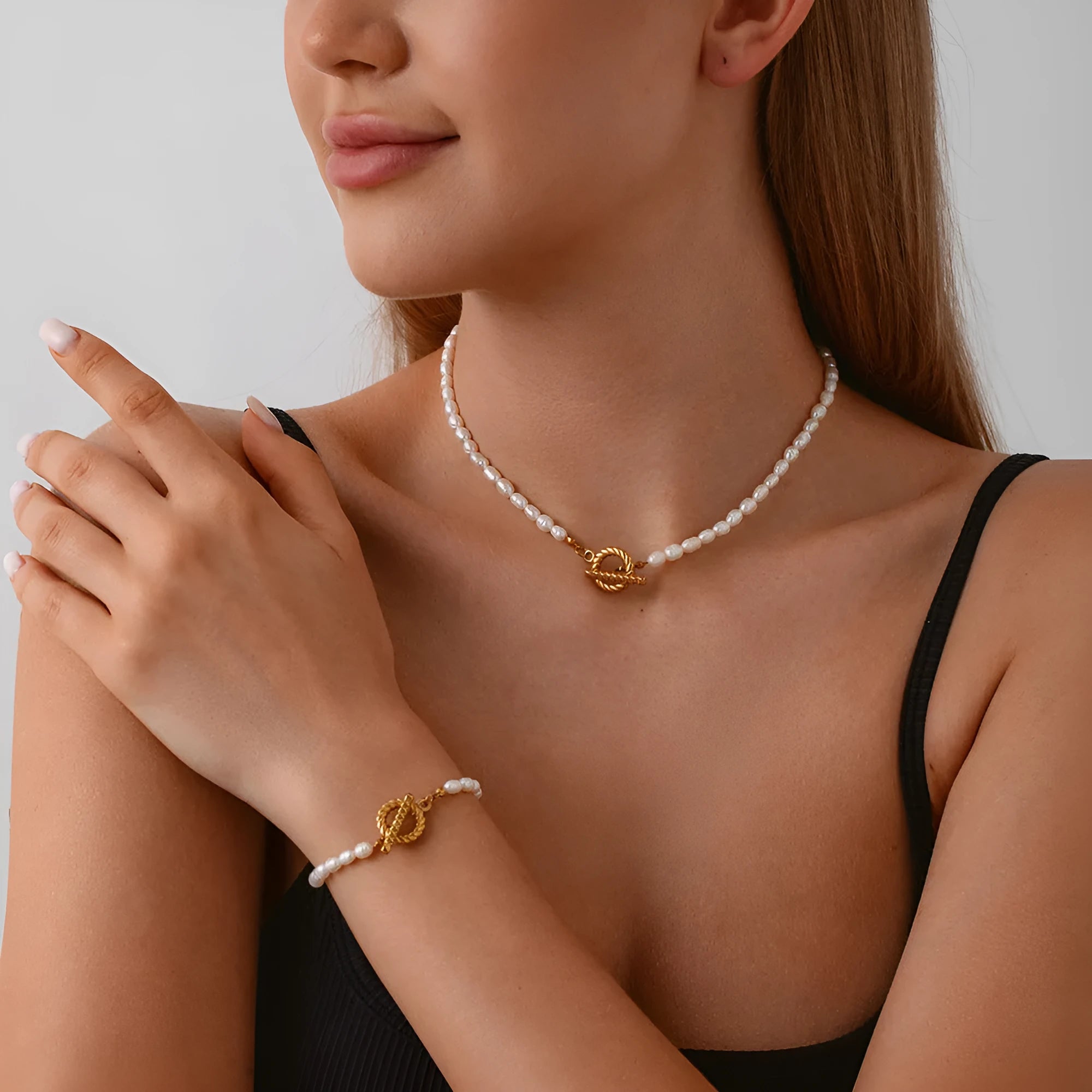 Freshwater pearl and stainless steel necklace bracelet set with geometric shapes on clavicle chain