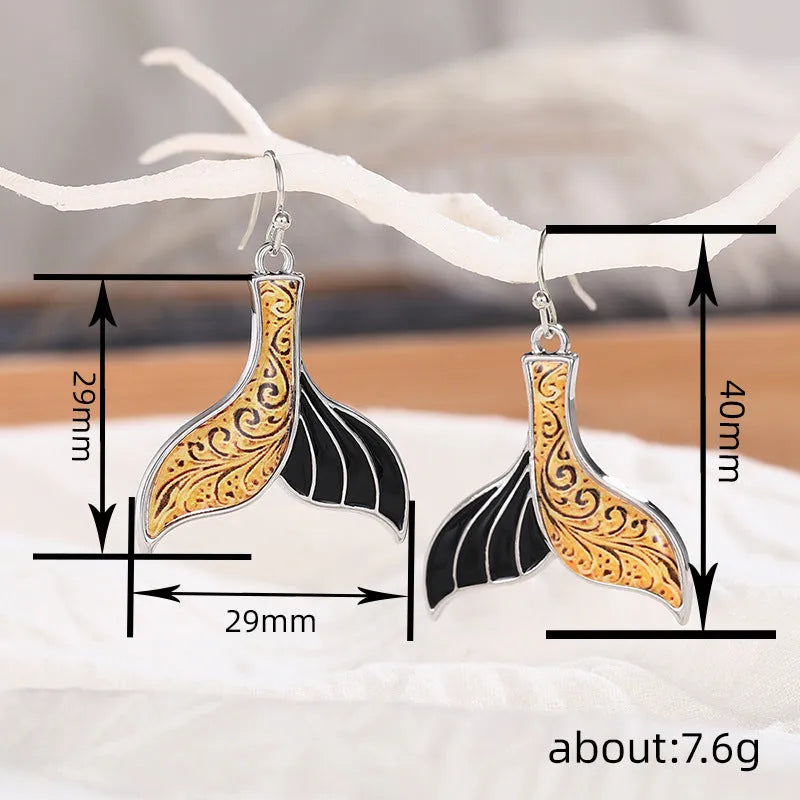 Women's white gold-colour fishtail earrings with whale design elements in retro style
