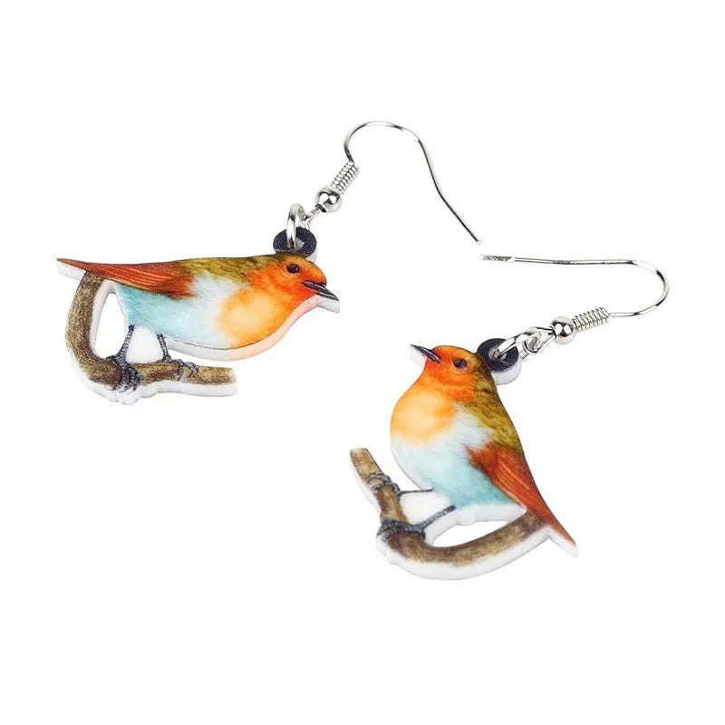 Blue titmouse bird design acrylic pendant earrings with geometric and snake detailing.