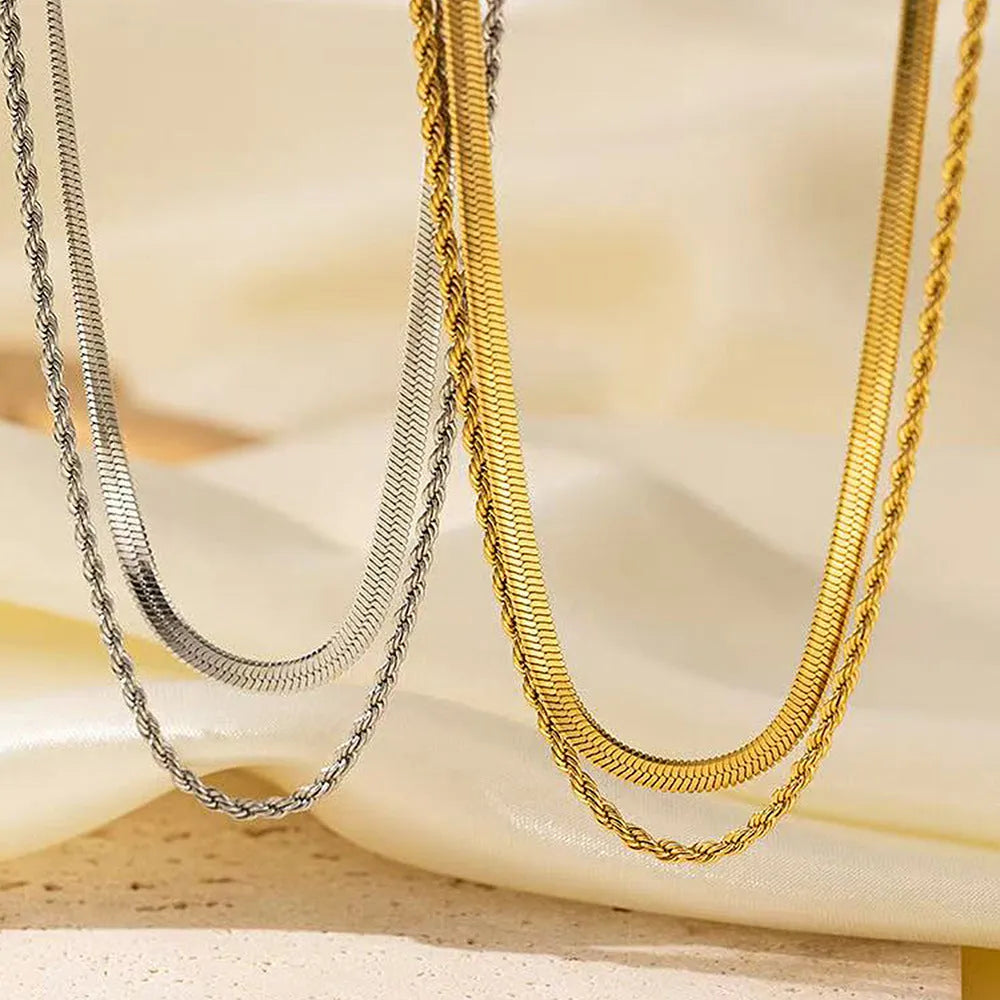 Retro double-layer twist necklace with geometric titanium steel pendant on an adjustable snake bones chain.