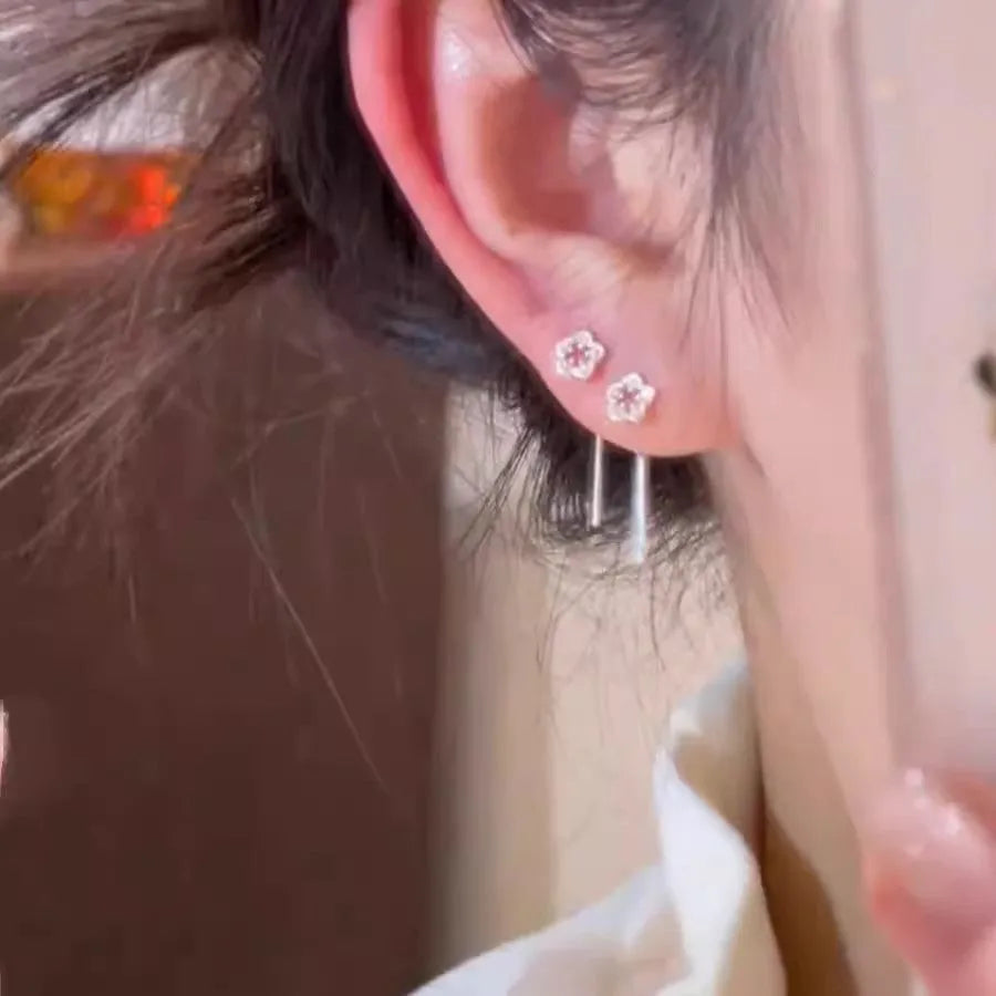 Pair of alloy silver hollow flower hanging earrings
