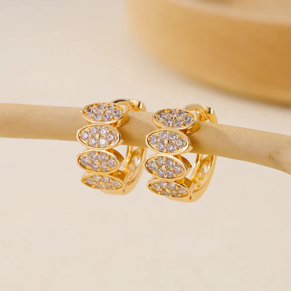 Gold colour women's earrings with zircon stones and zirconium inlay on copper construction