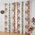 Rectangular printed polyester curtain with festive design hanging in a window