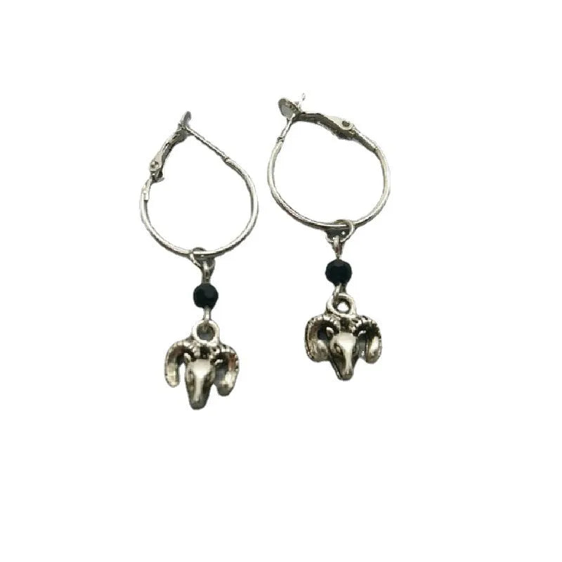 Silver round ring alloy earrings with Tibetan antelope design from Yunnan.