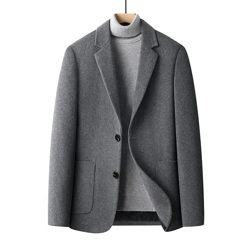 Men's slim fit wool suit jacket in grey shown on a hanger.