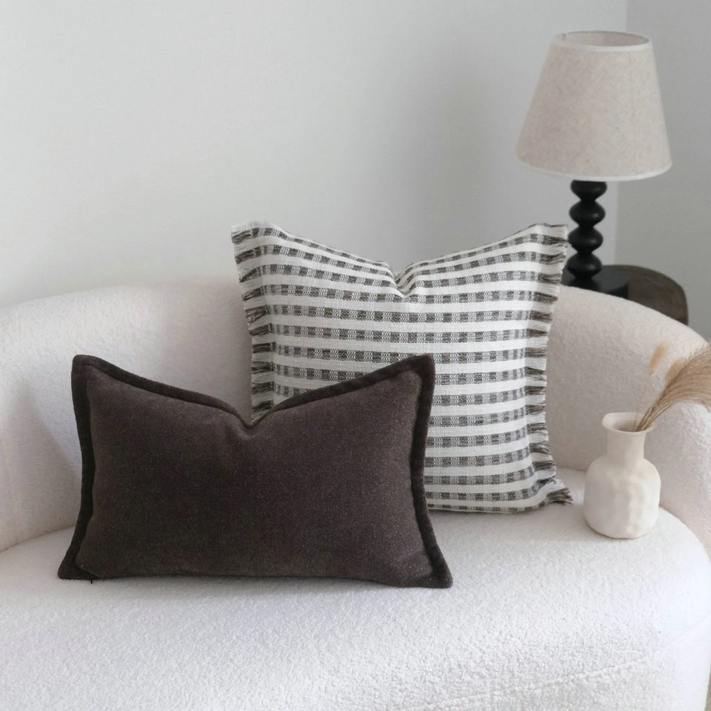 Coffee brown mid-century modern striped cushion on a sofa, showing 30x50cm and 45x45cm size options.