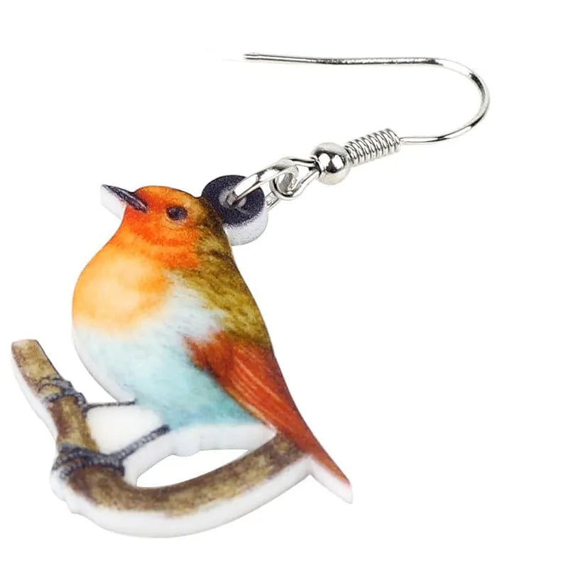Blue titmouse bird design acrylic pendant earrings with geometric and snake detailing.