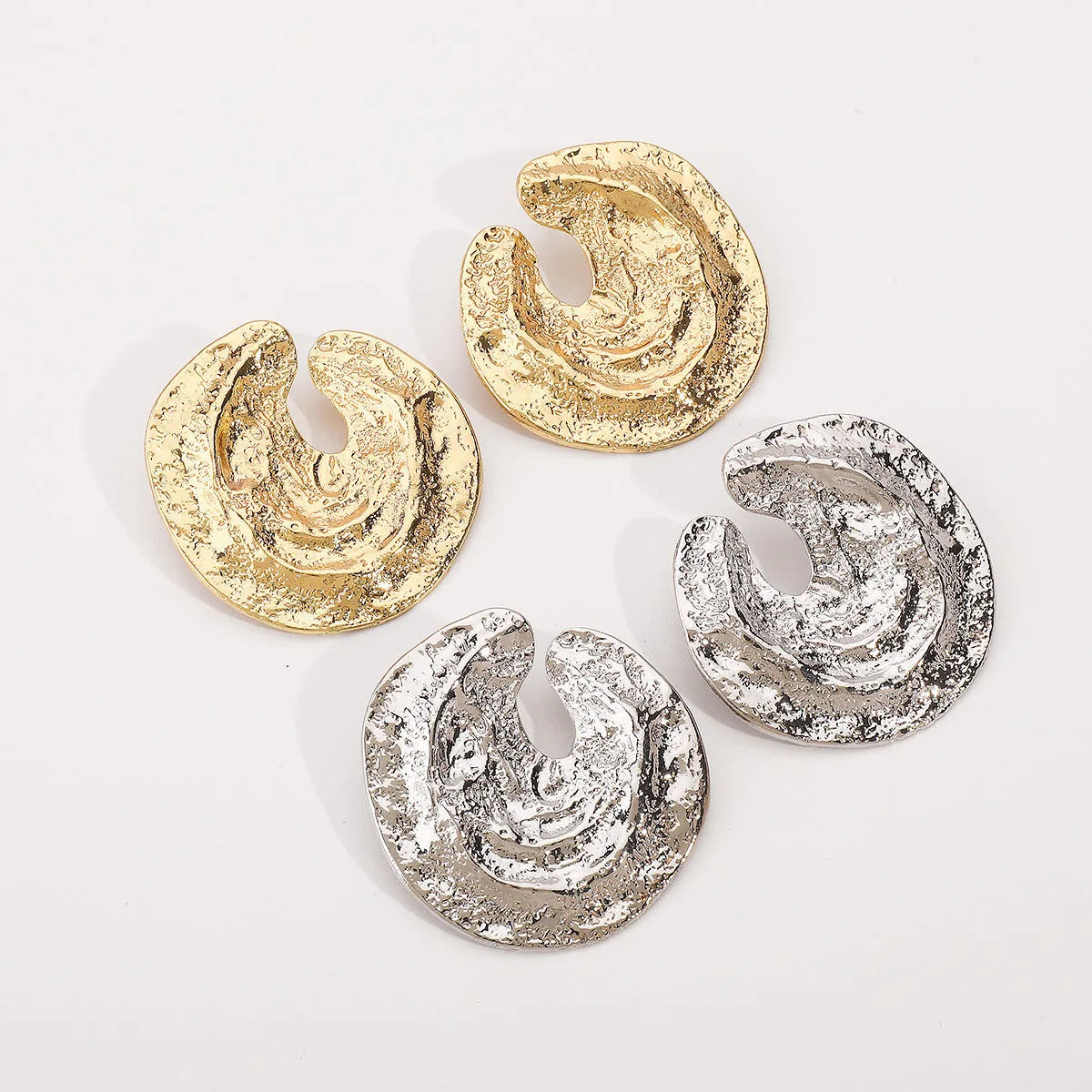 Geometric women's earrings with exaggerated pleated design and concave-convex texture in gold and white K colours