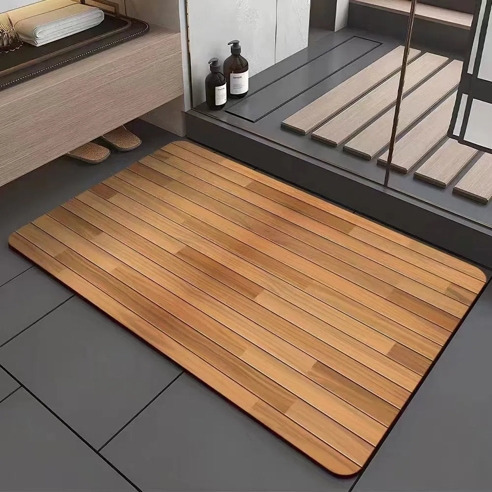 Square diatomite bathroom floor mat with wood grain geometric pattern on a tiled floor.