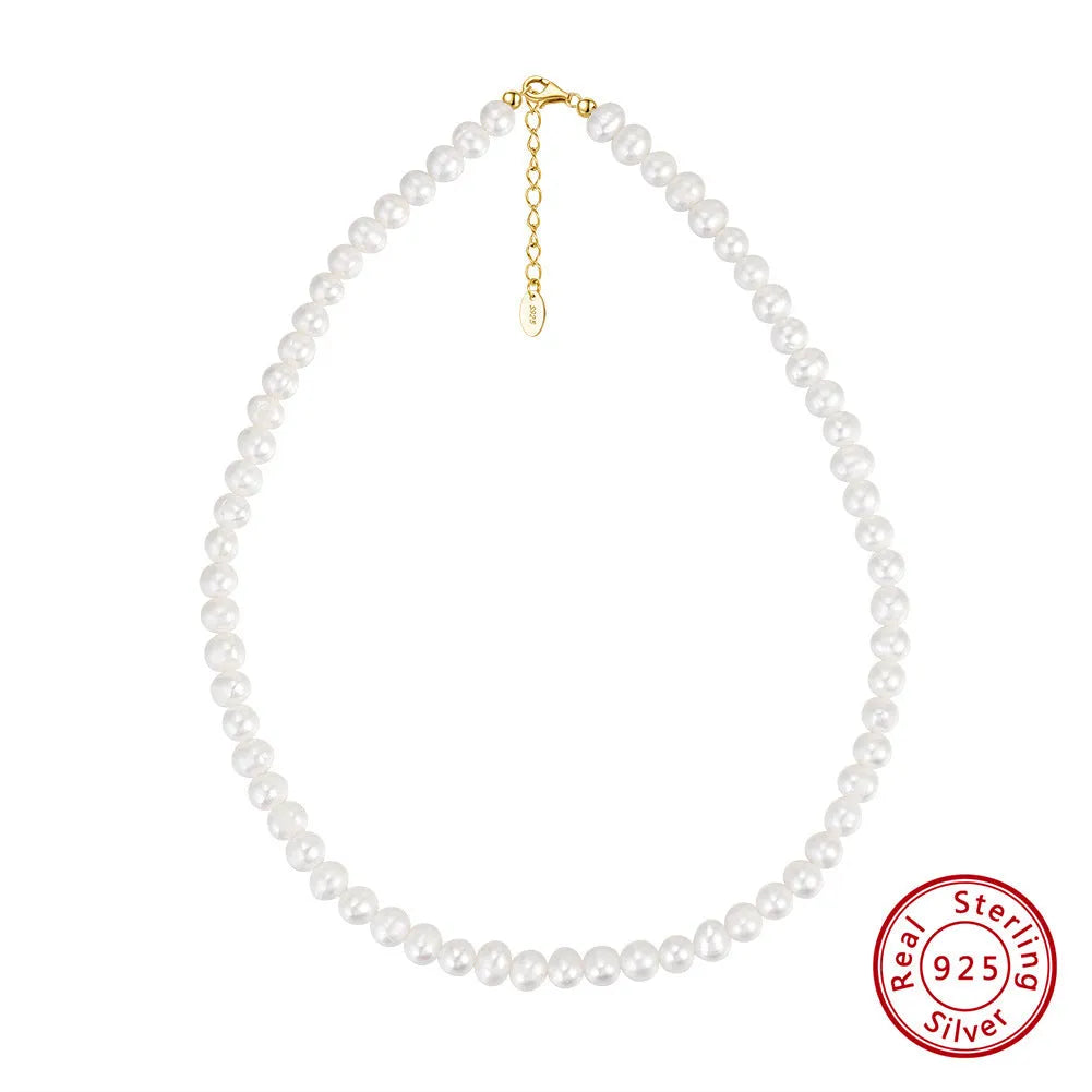 Women's silver adjustable chain necklace with a single natural freshwater pearl.