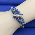 Copper fashion bracelet with gold electroplating and coloured zircon stones in ice flower design