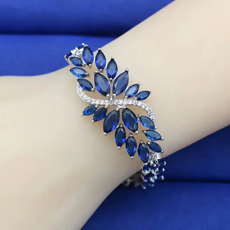 Copper fashion bracelet with gold electroplating and coloured zircon stones in ice flower design
