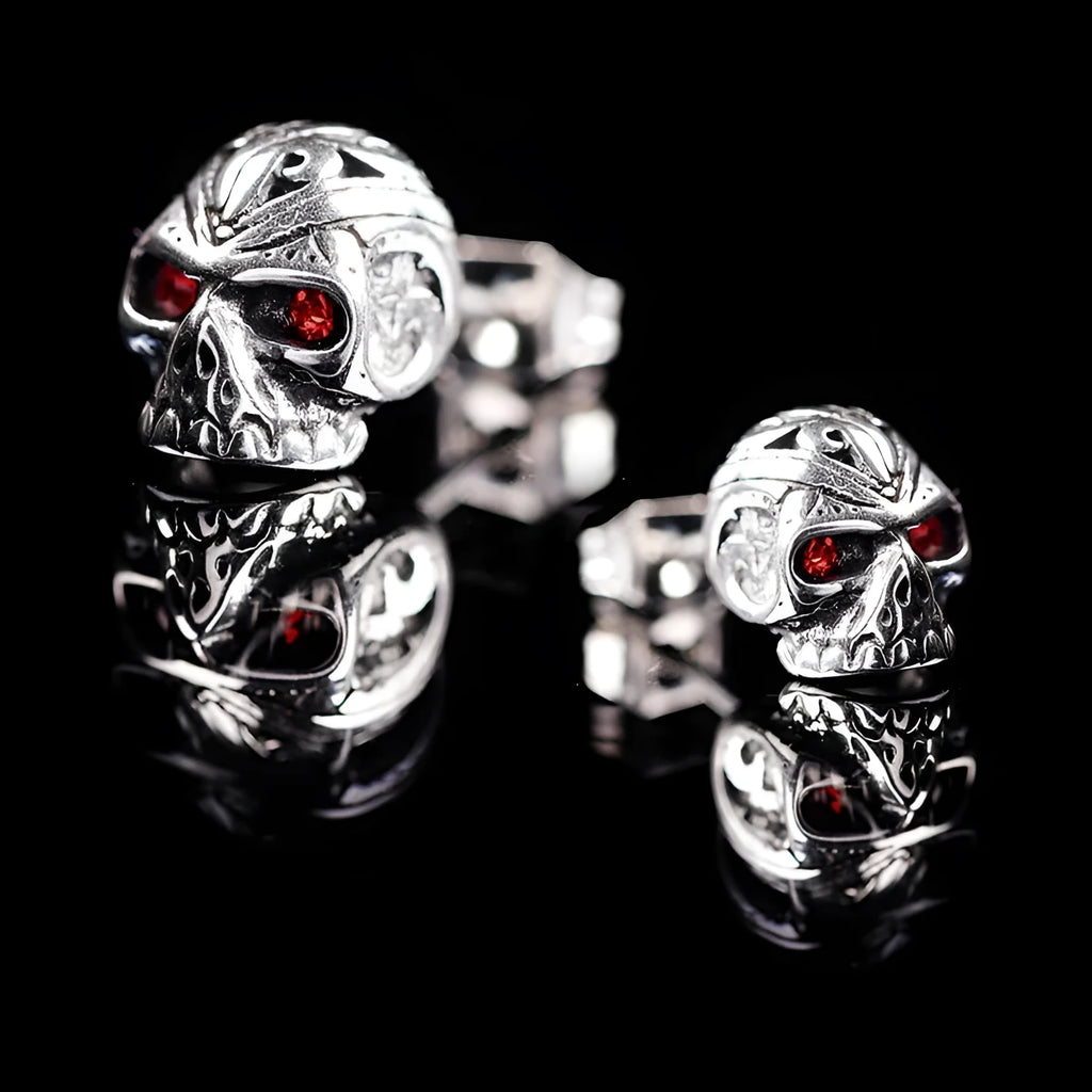 Retro ghost head skull stud earrings with red eye detailing on electroplated alloy