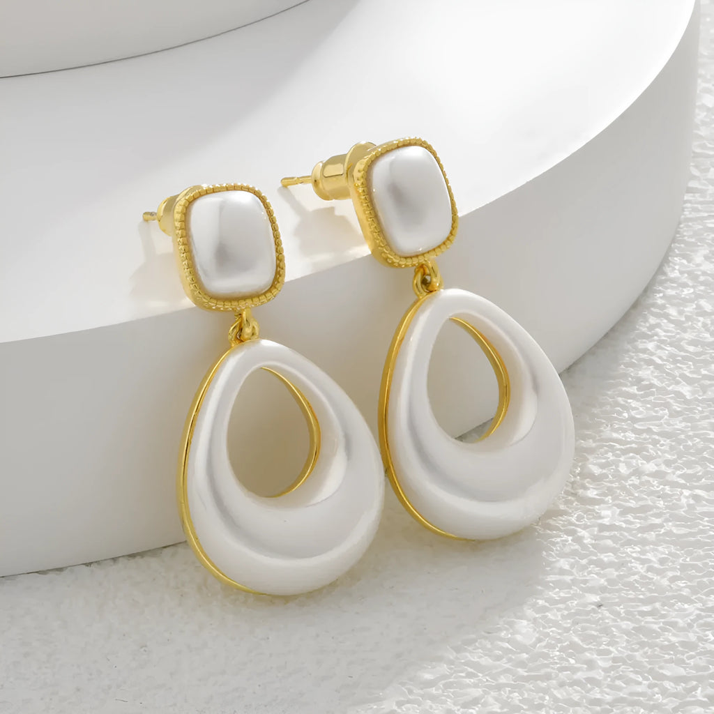 Gold-coloured water drop shaped mabe pearl earrings with imitation pearl components