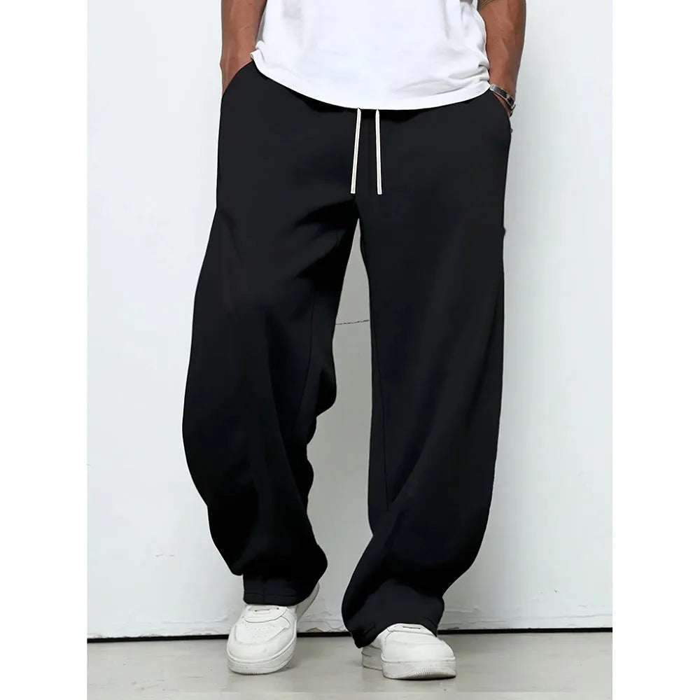Men's straight-leg casual trousers in black with an elastic drawstring waistband.