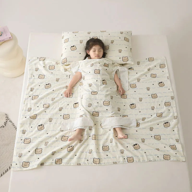 Patterned anti-kick sleeping bag blanket laid flat on a bed, showing its quilted texture.