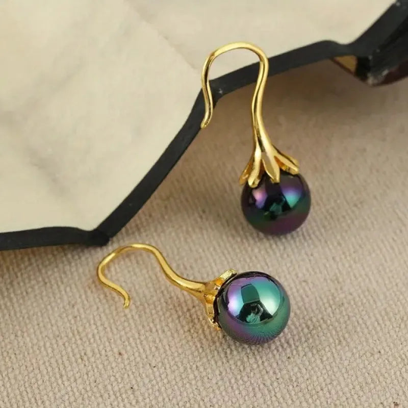 Gold retro fashion women's earrings with personalised creative design and alloy construction