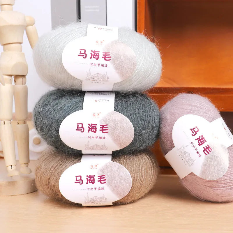 Ball of mohair yarn with Inverness thread for DIY scarf knitting kit in various colours.