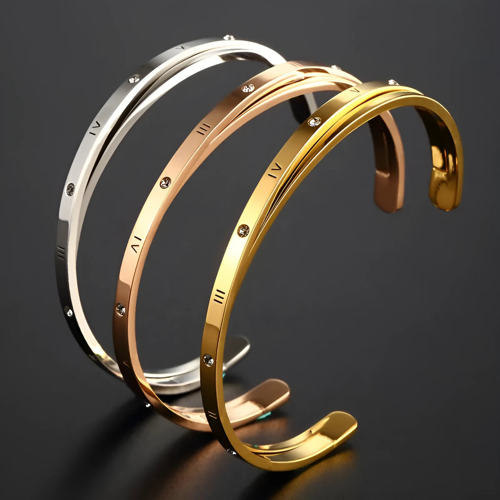 Open-ended adjustable ladies bracelet in stainless steel with zircon detailing showing gold colour finish
