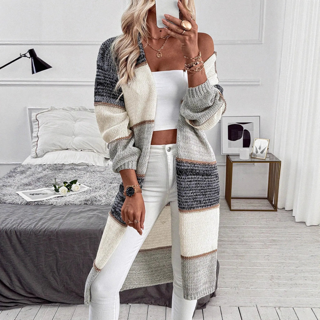 Grey women's loose-fit knitted cardigan with long sleeves in a striped pattern.