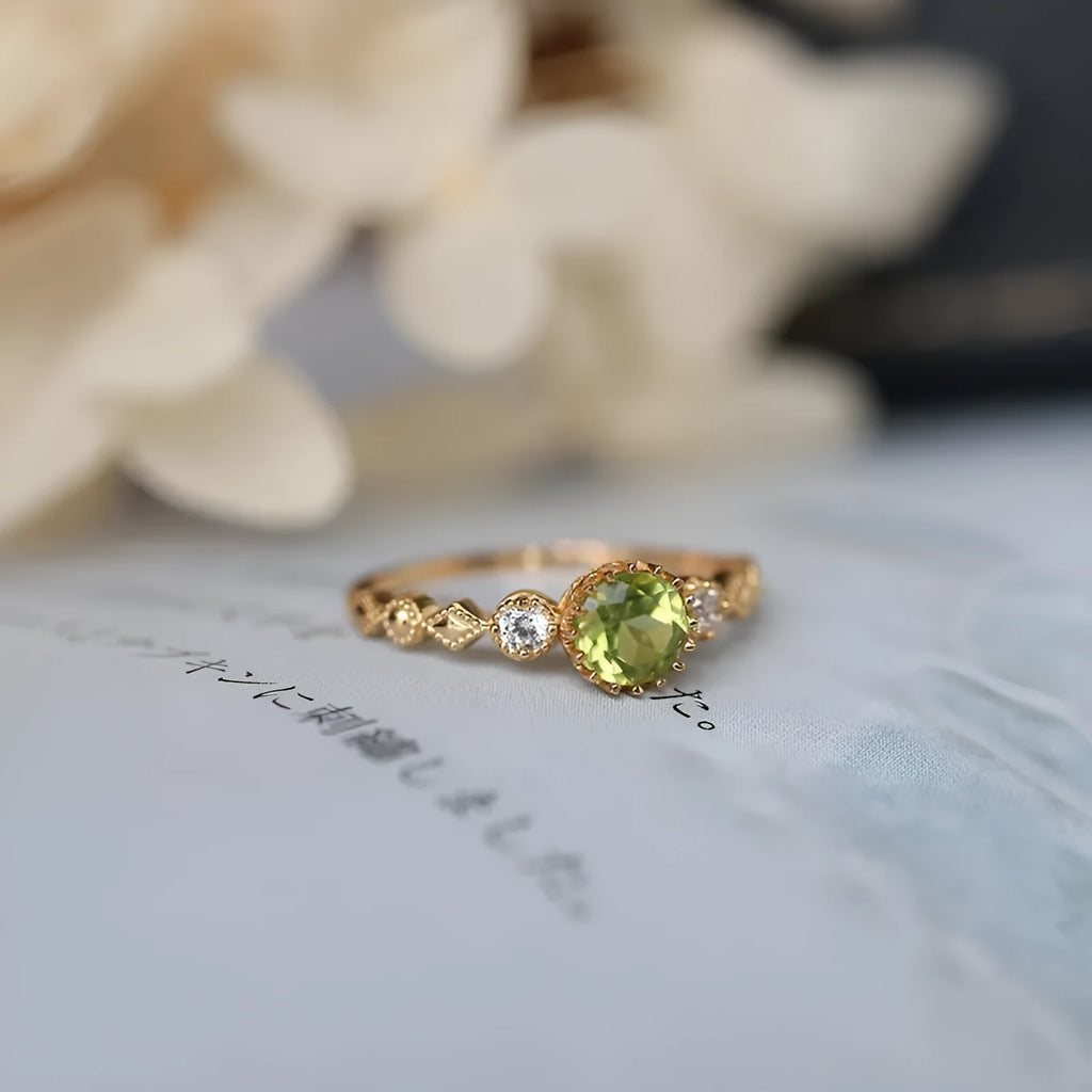 Copper women's ring with a green geometric quadrilateral stone in a Japanese style design.