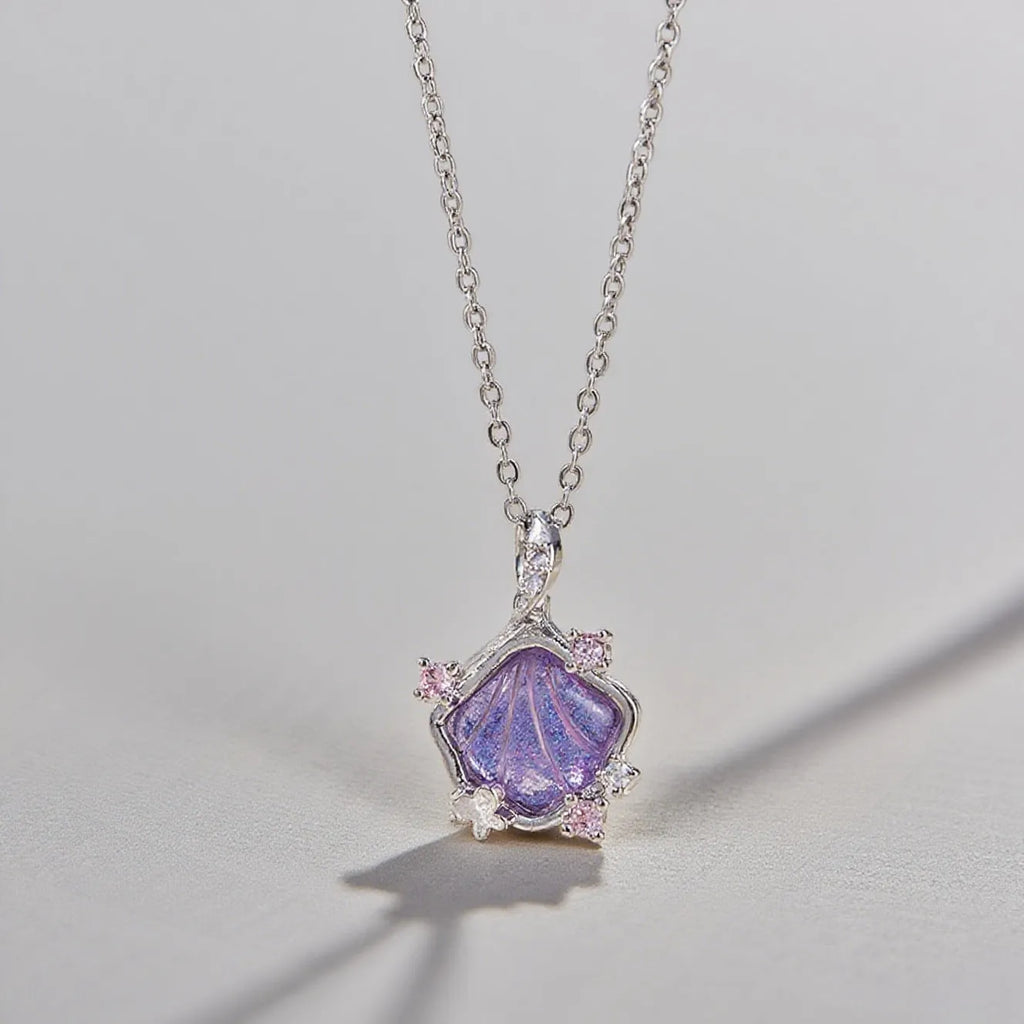 Geometric shell pendant necklace with electroplated copper pendant on stainless steel O-shaped chain, close-up view