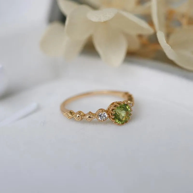 Copper women's ring with a green geometric quadrilateral stone in a Japanese style design.