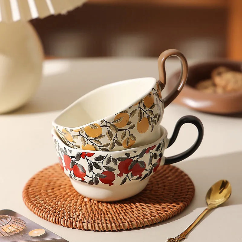 Antique style ceramic coffee cup and saucer set with medieval botanical print in black or orange.