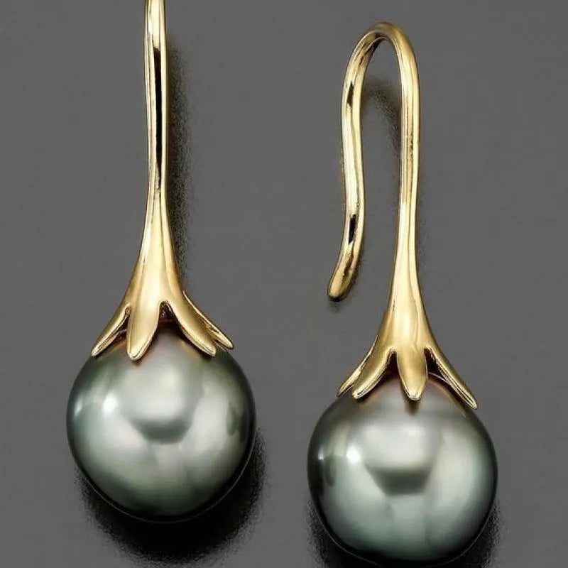 Gold retro fashion women's earrings with personalised creative design and alloy construction