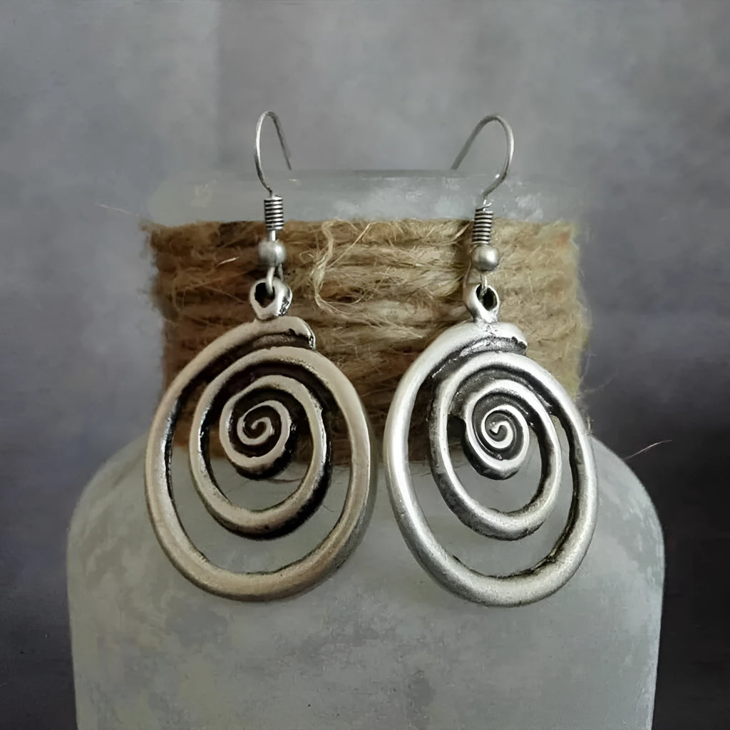 Geometric spiral earrings with distressed silver finish, measuring 5cm long