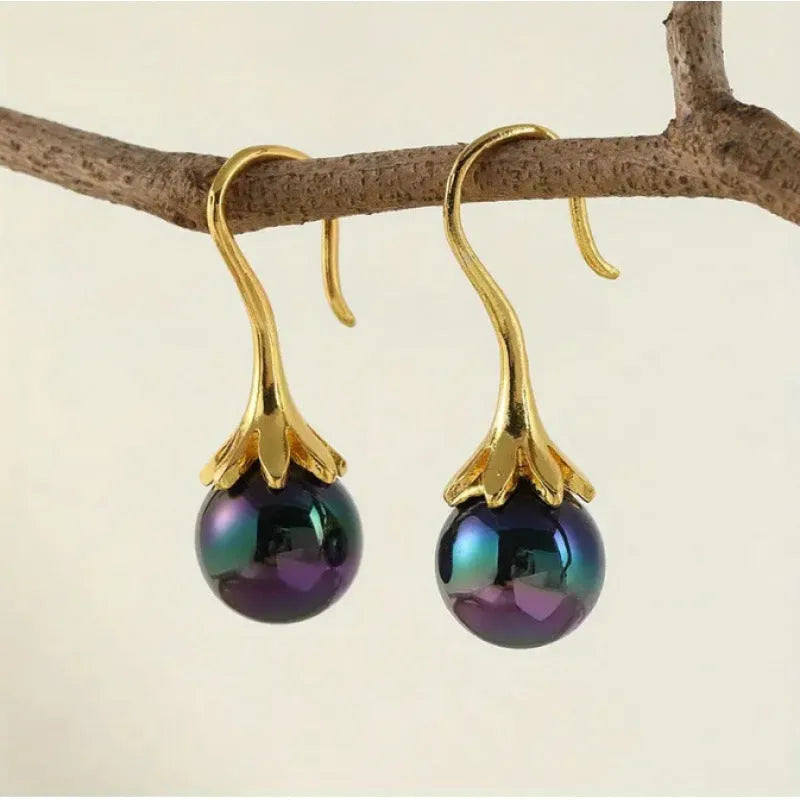 Gold retro fashion women's earrings with personalised creative design and alloy construction