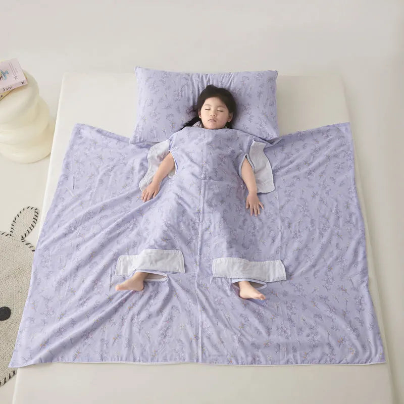 Patterned anti-kick sleeping bag blanket laid flat on a bed, showing its quilted texture.