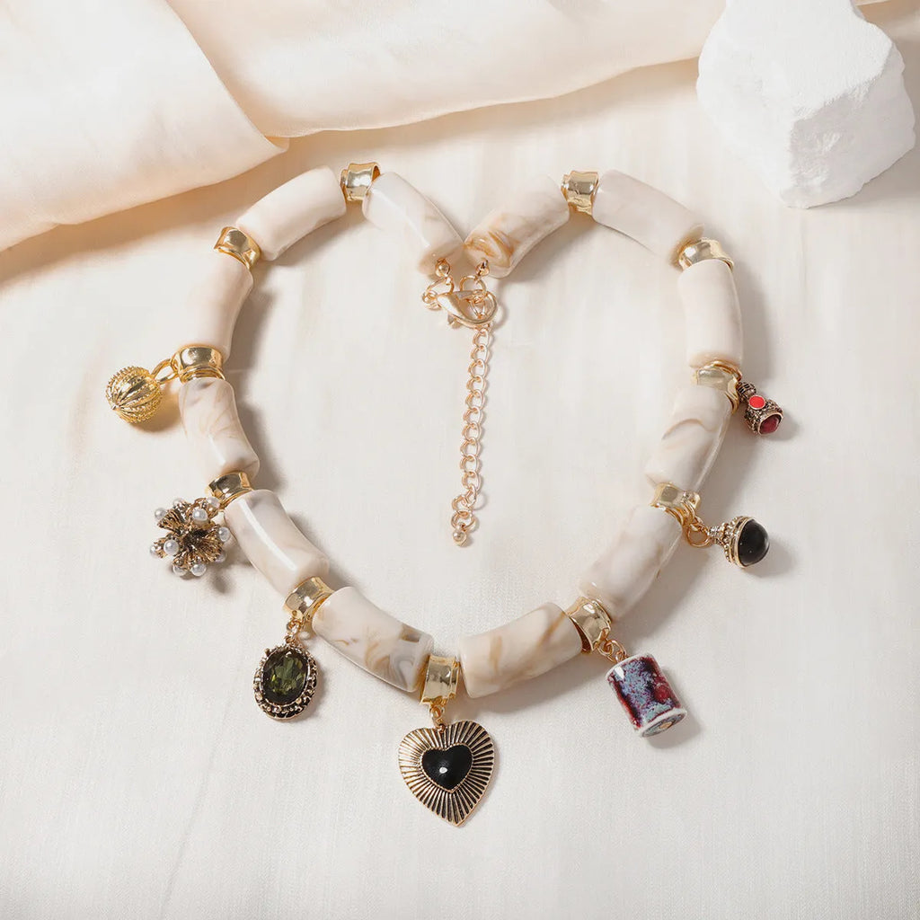 Heart-shaped resin bamboo necklace with electroplated finish in pictured colour