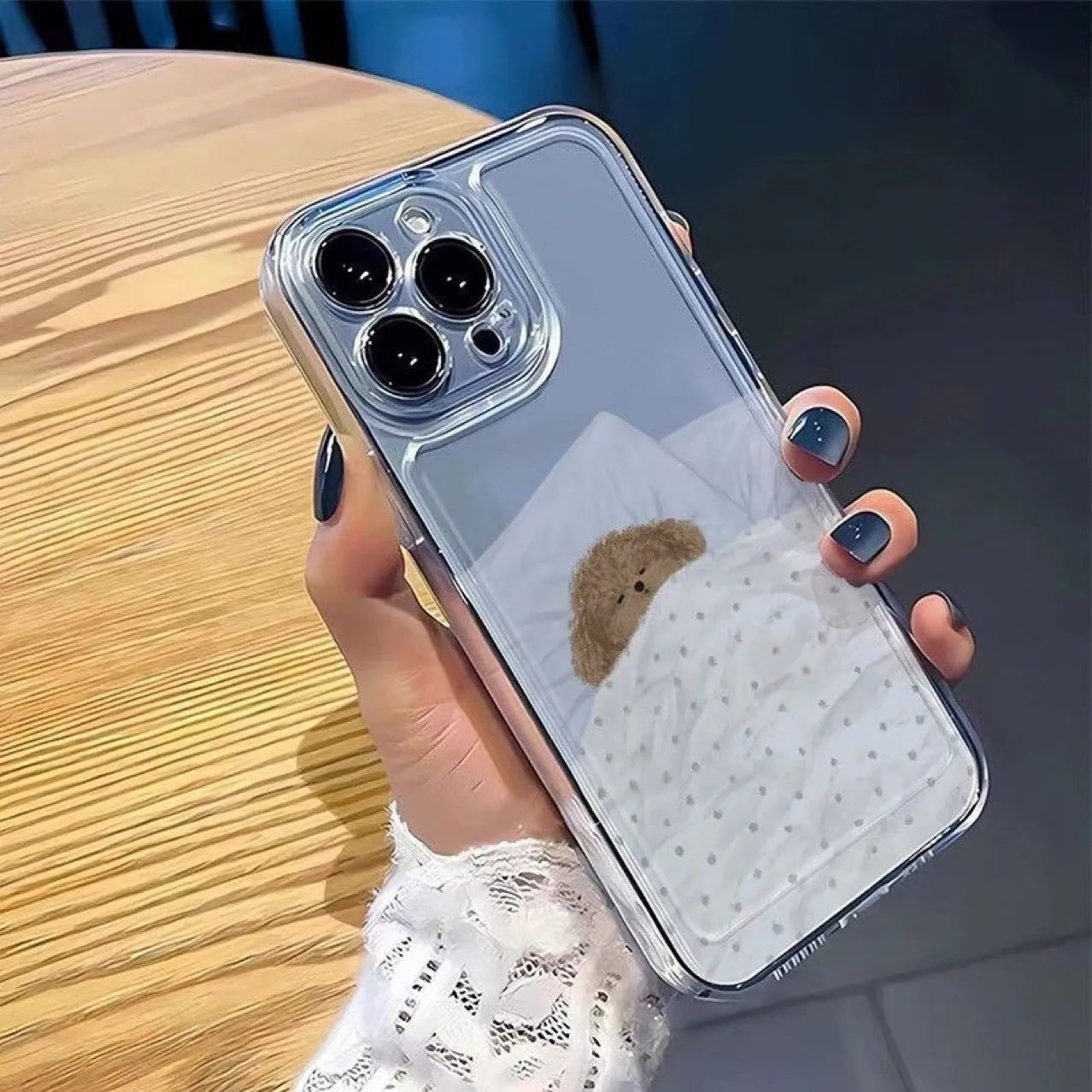 Transparent Apple iPhone case showing a sleeping cat pattern design on a clear TPU background.