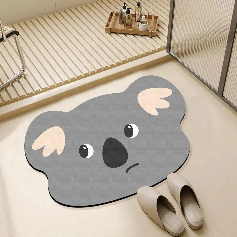 Thickened diatom oil bathroom mat with cartoon animal design in alien shape for shower area water absorption.