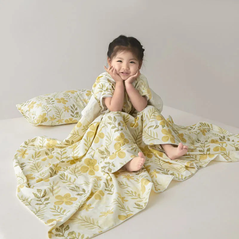 Patterned anti-kick sleeping bag blanket laid flat on a bed, showing its quilted texture.