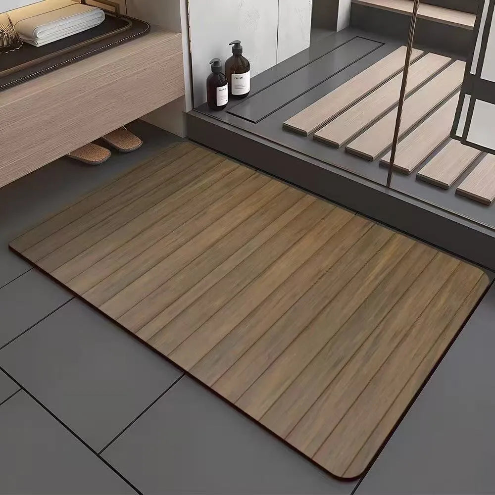Square diatomite bathroom floor mat with wood grain geometric pattern on a tiled floor.