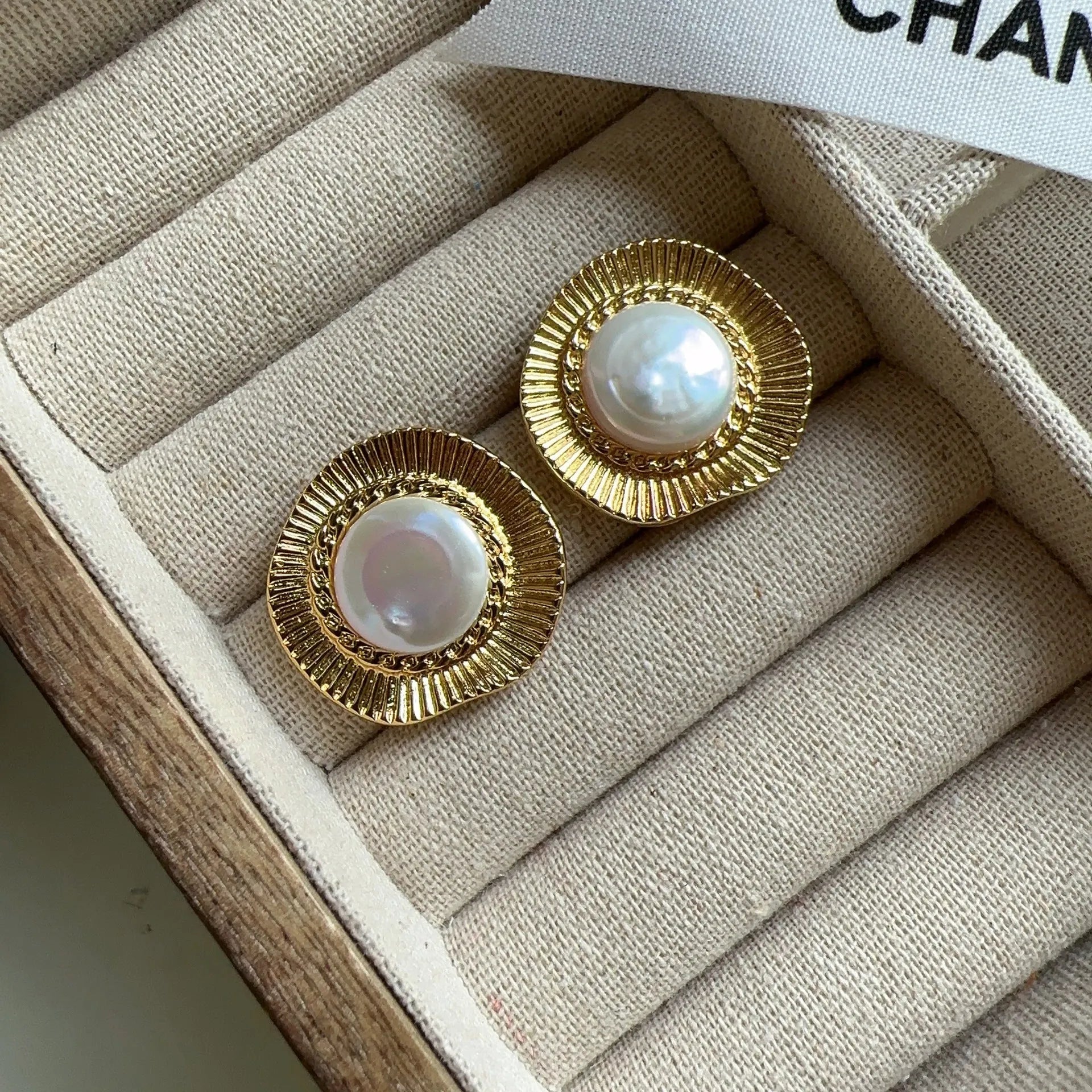 A pair of round gold electroplated earrings with a French retro simple style for women.