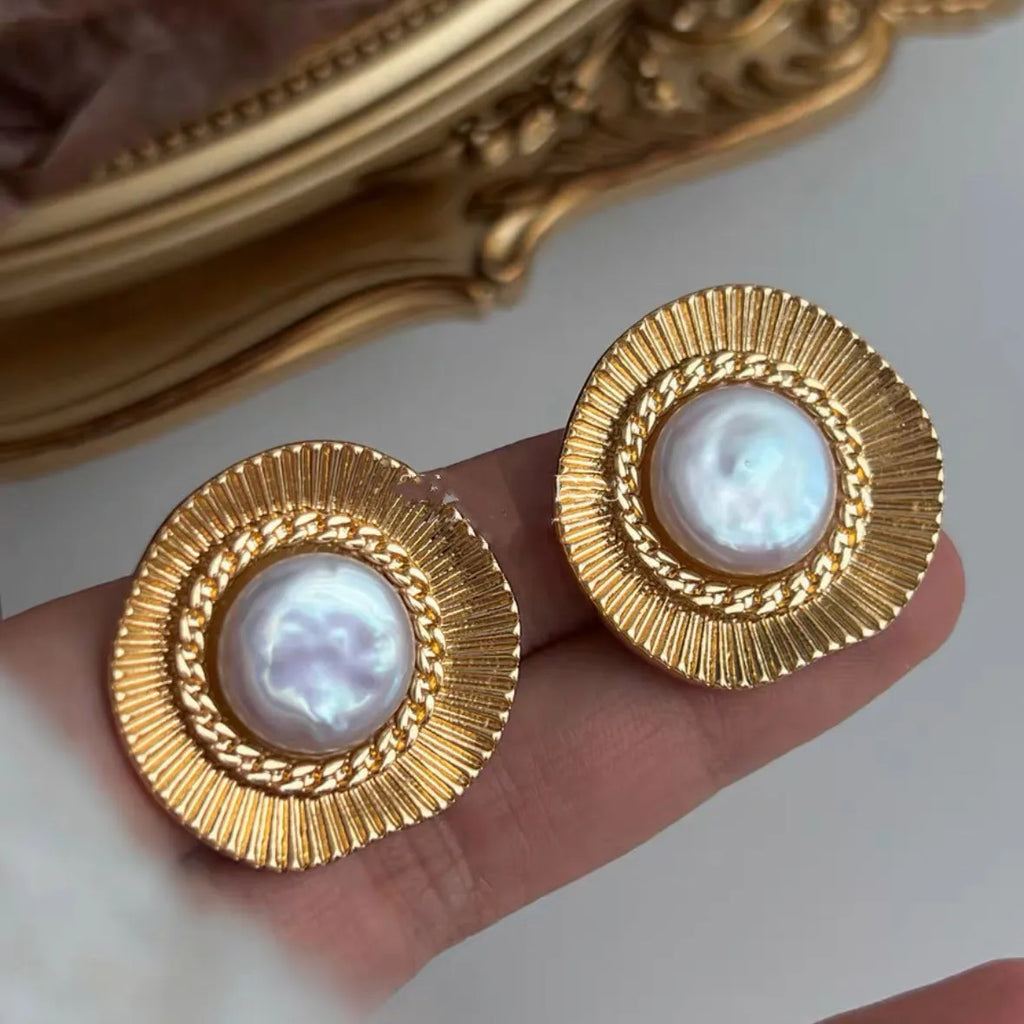 A pair of round gold electroplated earrings with a French retro simple style for women.