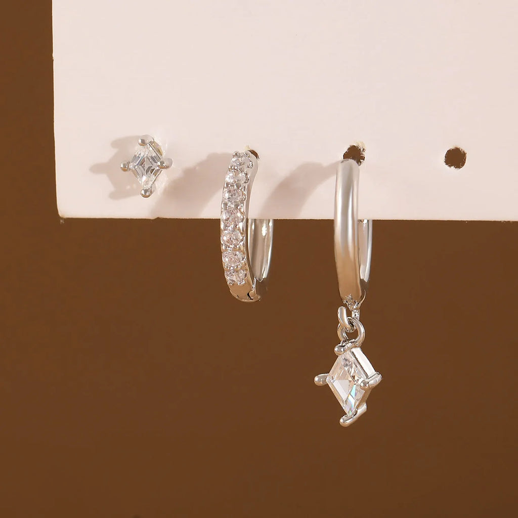 Ladies geometric zircon earring three-piece set in gold and silver colours showing pendant, stud, and clip styles