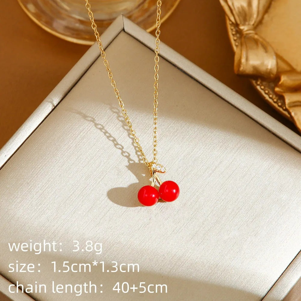 Titanium steel necklace with a delicate cherry charm on an O-ring chain.