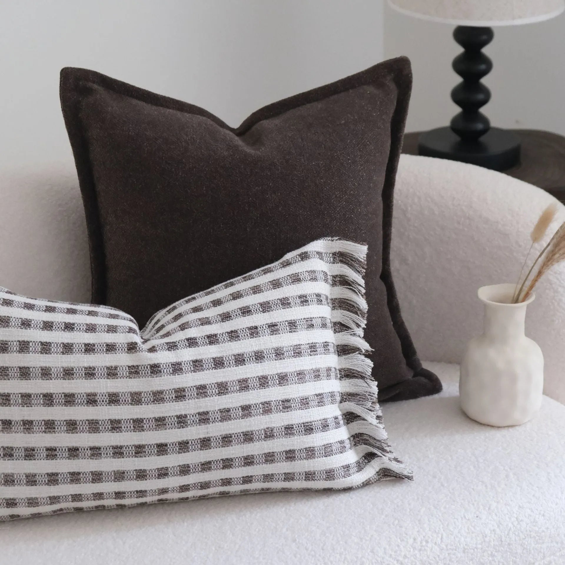 Coffee brown mid-century modern striped cushion on a sofa, showing 30x50cm and 45x45cm size options.