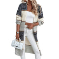 Grey women's loose-fit knitted cardigan with long sleeves in a striped pattern.