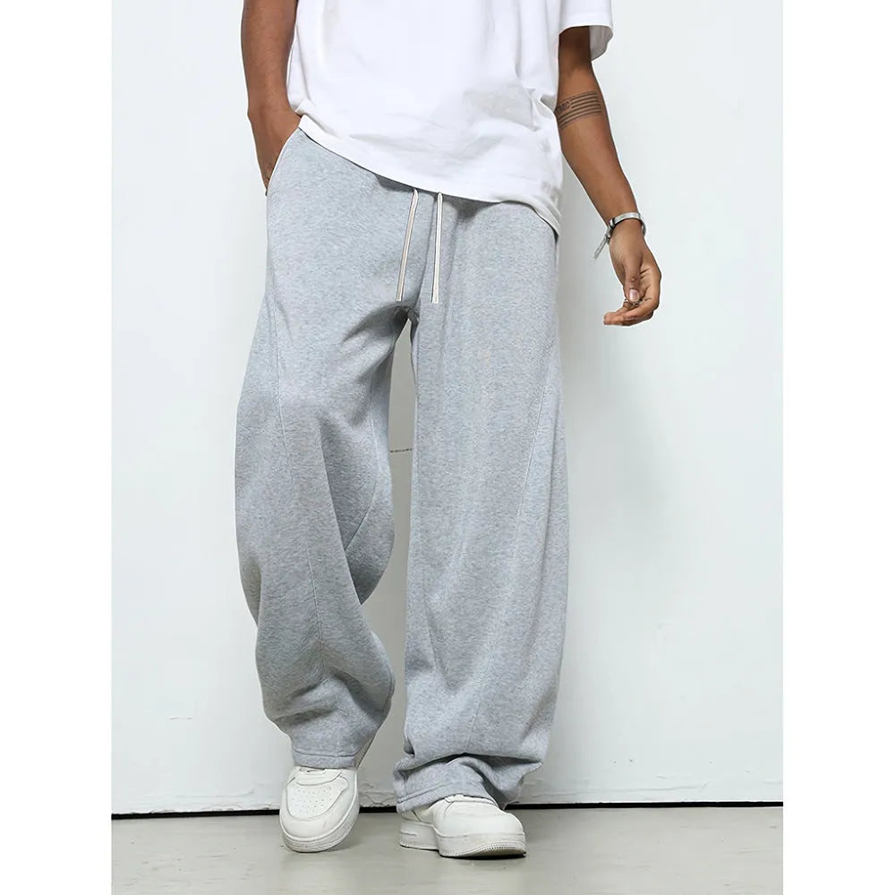 Men's straight-leg casual trousers in black with an elastic drawstring waistband.