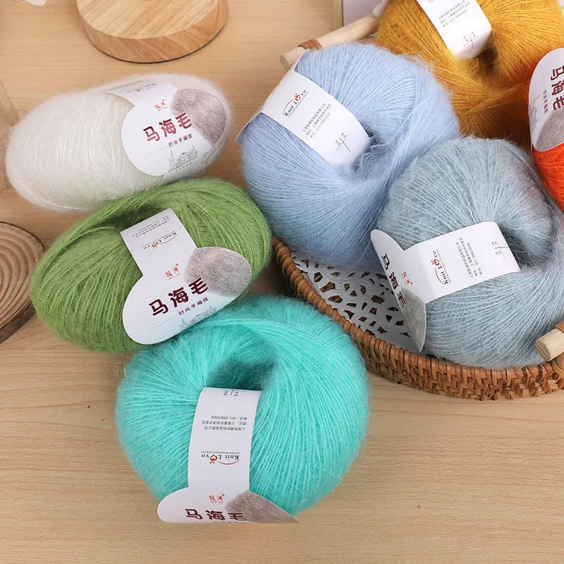 Ball of mohair yarn with Inverness thread for DIY scarf knitting kit in various colours.